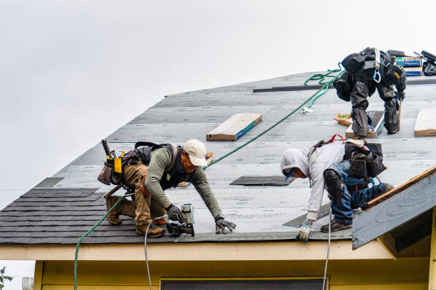 Professional Roof Replacement technician working in Hightstown, NJ